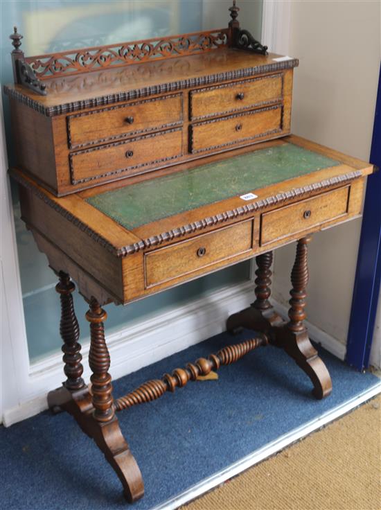A Victorian rosewood writing desk, W.71cm